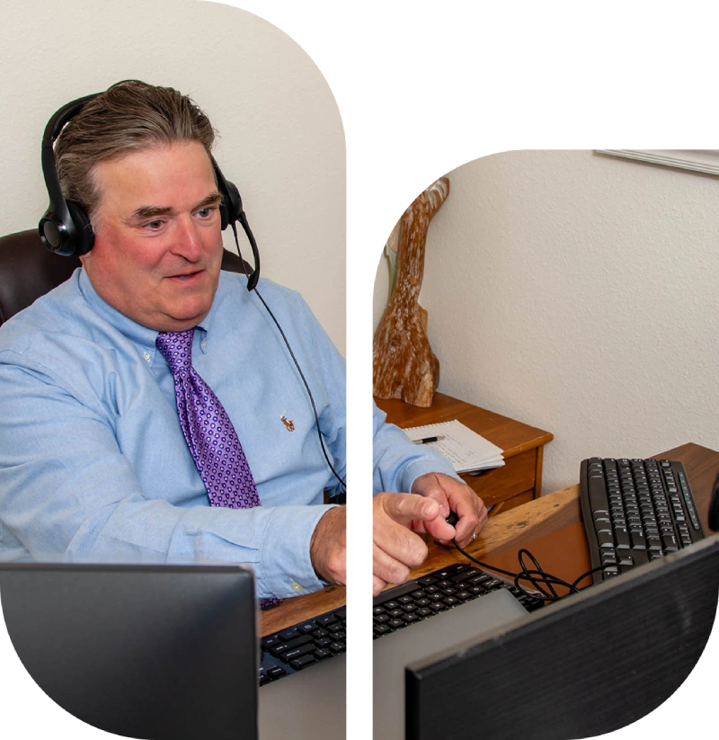 Man in headset working on computer.